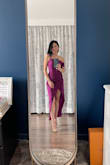 This dress is unique, yet has a brush of timelessness to it. I got the LAST magenta one in my size and I'm so glad I did. The magenta gives off a more flirty, fun vibe, whereas the navy looks more elegant. 

The only reason it doesn't get 5 stars is that the slit goes up VERY high, so you'll need to be conscious about that while sitting or dancing. You will also need to reinforce the sewing on the little clasps at the top of the zipper. - Danielle L.