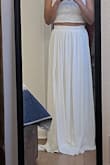 I love this piece. I'm 5'2". 110 lbs. Inverted triangle body shape. I chose S. The skirt is too long for me so I will have to tailor it. Fits nicely around the waist. The shirt fits like a glove. - Mariella H.