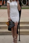 I got this as one of my dresses for my graduation pictures! It fits snugly but as expected. I really loved the back for pictures. - Skylar K.