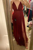 I loved this dress. I very nearly picked it for my black tie event but ended up choosing a dress that I liked even more. I really like this dress though. I LOVE the double-high slits and the tulle overlay that just adds to the sexiness. I also love the way my cleavage looked even though it is a tad bit roomy in the bust (the adjustable straps help). My only complaint is that the tulle outer layer feels extremely fragile. I would be concerned about it getting stepped on or snagged or ripped if I wore it out. Very lightweight and comfortable. - Alexa H.