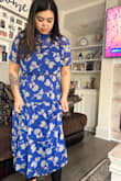 Stretchy and also loose, originally got xl but returned and exchanged to Large and it fits perfectly. I actually got 3 colors and all beautiful = - Belle D.
