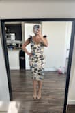 I bought this dress for an anniversary weekend, it was so beautiful, however, I had it altered before my trip because the top was weirdly big. I should have listened to other reviews, but I just loved it I had to try it for myself. The straps needed to be shortened ( now I know why the model is posed like that because even after altering when my arms were down, the straps fell.). The bust was large, while the bottom was a little snug around my thighs and hips. I'm keeping it because I altered it and I may be able to shrink my thighs and do enough chest press to make it fit like I think it should, but the dress itself looks and feels much more expensive than it is. The picture was taken before alterations. - Gina M.
