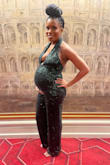 I loved this jumpsuit! I am usually a small but I ordered a medium for my growing baby bump and it for just right. I had to get the bust and halter tightened and pants hemmed and it fit to a tee. Like a glove, as in no more room lol but I loved it. I felt so sexy and elegant. It was perfect for my babymoon in Vegas. Received tons of compliments - Tia K.