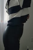 I have a petite body frame. However, I am a bit on the curvier side. I'm 35 years young and I'm in fairly good shape, these pants accented all the things I don't like. It's created a pooch, but I have a relatively flat stomach. My butt was cut in half. I have a nice butt and it's definitely not completely flat. These pants are tight and flatten my butt like a pancake. But the rest of the pants were loose throughout the thigh. The model in the pic is thin and slender.  It looks wonderful on that body type. I'm not sure these pants are petite curvy friendly. If I sized up I'm sure that my butt would fit a lot better but the rest would be ill fitting. - Diana C.