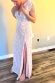First of all the dress arrived in like 3 days. I am super impressed with the quality of materials the dress is beautiful. I love it. I just need to add some padding in the chest for my lack of breasts. These are try on photos only the wedding is in 6 months:) - Tierney F.