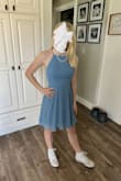 My daughter wore this to her 7th grade dance and it fit perfect!! The material is super comfy and she loved it! I bought her the XS and the sides of the chest were just a little loose, so we used double stick fashion tape and that helps it stay right in place. The back straps are also adjustable so that helped a lot to have her fit her petite size. Would buy again! - Laura S.