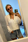 I really love this shirt! The only issue is that it seems to shrink when washed (and not put in the dryer) it feels smaller than when I first got it so maybe size up?? But I truly do love it still!

Edit: I realized that it kind of shrivels up when it gets washed. But once I steamed it, it went back to its original size and I have had no problem washing it on a gentle cycle and hang drying it. I now think the original size was good and don't recommend sizing up. - Michelle L.