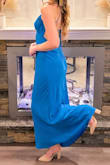 I bought this dress for a formal party and it was perfect! Since you tie the straps and they're easily adjustable, you can make the top fit exactly how you want it to. The fabric is lightweight and comfortable. I wore 4-4 1/2 inch heels with it and the length of the dress flowed great! If you're looking for something a bit more form fitting this might not be the dress for you as it sits a little looser around the edges. Overall, great dress! - Sara S.