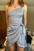 This dress is really flattering! The slit where it wraps over is a little dangerously short on me but I just pull it to the side and the dress is a little longer in the back which makes it feel classier. The material definitely wrinkles but I'm going to wear it still for a summer wedding. - Alyssa