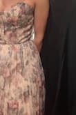 the corset top is to die for. the back is a beautiful cross tie. the corset too is also padded. the pleated bottom is very nice and it's a high quality dress - Carlie F.
