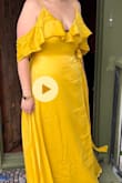 Dress itself is ok, looks fine on but has flaws. The top button absolutely won't stay clasped and I can't wear it because it would expose my boobs (photo has a clip on). It's also not very flattering around the tummy for a wrap. I'm officiant for a wedding, and it's so hard to find gowns in this color. Unfortunately, I've been busy this month and I'm kicking myself over missing the return deadline. I'll have to keep it even though I won't be able to wear it without alteration. - Samantha