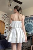As a tall person who is a bit smaller chested I struggle with online shopping for clothes, especially dresses. This was one of two white dress I ordered from Lulus and when i ordered it I had hoped that it was going to feel really nice and look good on me. I have never really been one for dresses as my body was a huge insecurity for me growing up but since I got engaged 6 months ago I have been determined to get myself some really cute bridal outfits. This one I ordered for our engagement photo shoot coming up in April and I cannot exaggerate enough how much I love this dress. I got it in a size small and it fits me very well. The ruffles are a thicker material which I really like because it keeps the bottom part of the dress down even in the wind (which will work very well for my engagement photos on the beach!). This dress looks just like the modeled photo. I'm very excited to wear it to my engagement photos shoot and I love that I feel comfortable and confident wearing it. - Renee L.