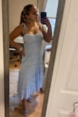 This dress is amazing! The fit is perfect, would definitely say true to size! It holds up the chest and you can tie the ties as tight or loose as you need. I'm bigger chested & the "cups" fit perfect. This dress is so flattering and so perfect for spring! - Sierra M.