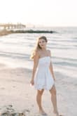 I love this dress! It was perfect for my engagement photoshoot and was very comfortable. I usually worry with strapless dresses, but it has a sticky top to stay up no problem. I even wore this in the water during my shoot and it wasn't see-through! - Nicole B.