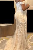 This dress is absolutely beautiful. It fit nearly perfectly, only a tad snug. Size up if you're in between sizes. It has a light tan/dark beige color underneath. The silhouette and craftsmanship is wonderful. This wasn't the dress for me since I didn't like the no-shoulder look, but it's still beautiful. - Paige N.