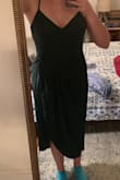Please excuse the blue socks. The green doesn't show well in this picture, but is very close to the model and is quite flattering with my dark hair. I really like this dress. It has great movement and is very comfortable while also feeling fancy. If planning on wearing to a wedding it will gap open quite a bit if dancing/squatting down, but really not much problem other than that. Is nice without a bra. - Virginia H.