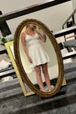 Bought this as an option to wear to my elopement. Although I didn't end up wearing it, it was really flattering on and fit well. The lace in the back is stretchy and adds a bit of interest to an otherwise simple dress. The dress was longer than I expected, which I liked as well. A bit too simple for the look I was going for but a great dress nonetheless :) - Claire S.