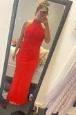 It's definitely more red than orange but it fits perfectly! Great for short girls and very flattering!! - Chanel C.