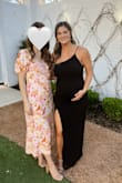 I am 30 weeks pregnant and this dress fit perfectly over my bump! There's plenty of stretch which makes it super comfortable! Pre-pregnancy size I am a small but got a large to fit the bump! - Ashlee G.