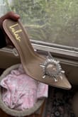 Okay, let me start off by saying this. Shipping 10/10, Customer service 10/10, Shoe design 10/10. This shoe is literal perfection. Looks absolutely beautiful out of the box! I would say that it runs a little small. I'm a size 8.5 and purchased a 9, the shoe fits great but the buckle design digs into my foot just a bit, it makes me concerned that it will pop off. That's literally the only flaw for me. 

I purchased this to wear with the Lulus wine red romantic flirt midi dress and they pair so beautifully together. I'm planning to wear it for my graduation photo shoot. 

100% would recommend for anyone to have. - Alexis C.