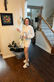 It's not very stretchy, but it's true to size. Looked super cute with some tennis shoes. I'm 5'9 so it's short on me, but I don't mind. - Katherine M.
