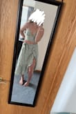 I love this outfit. I ordered a medium and usually I am closer to a large. It fits great on me. Because I have a smaller bust, there is room for a sticky bra or if you have a bigger bust. The material is light and soft. I plan to wear this to a summer wedding in Florida. - Olivia N.