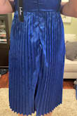 Stunning dress. It fit perfectly and the color was beautiful, but the pleating at the back around the zipper looked awful. The fabric was all bunched up and the skirt fell very awkwardly. I had to return it! - June D.