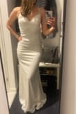 It's a really good buy. Heavy fabric, so it falls nicely and is forgiving with skin imperfections. Lacing in back lets you adjust tightness/fit. Fabric has some stretch so it fits well over the hips. Overall very happy with the dress! - Bringme T.