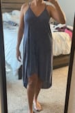 This dress will not fit the way it is advertised on the model. It states that the models are around 5'7 wearing an XS. I'm 5'5 wearing a M and this dress does meets well above my knee and does not fall to my ankles. It also doesn't sit low on the chest as it does on them. - Rebeca S.