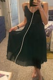 This dress is beautifully made but it is not flattering. Typically a size 0, this dress completely hides your figure. The pleats make you look boxy and larger. It's also quite heavy with thin straps. With movement it's pretty but standing still it's a hard NEXT. - Mackenzie K.