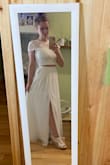 I originally ordered a Small and exchanged it with ease for a Medium. The Medium fits great. I will need it hemmed a bit and the top taken in around the bottom part because it feels a bit loose. But this is just all for comfort. The dress is great quality and I cannot wait to wear it on my wedding day. - Shannon F.