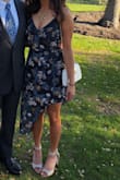 Wore this to a wedding and loved it! Beautiful fabric. I am on the shorter side and was worried it would make me look even shorter but the asymmetrical cut and some heels really helped. It does say it's teal but I think it was pretty definitively navy blue, so keep that in mind. Pretty tight in the chest area if you are curvy but that helped keep a strapless bra in place. - Ami V.