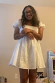 I was on the hunt for my grad dress and I instantly fell in love with this dress! I love the puff sleeves and the cute flower embroidery all throughout the dress! I didn't want to wear a generic white grad dress for my grad photos so I'm extremely happy I bought this. 
For reference, I am typically a size 4/6 and I am a 36C. I got a medium in the dress and the top fit me just right. I didn't want to size up to a Large as the bottom of the dress is super flowy for me already (I didn't want it to fit oversized on me) but keep this in mind if you purchase! Material is not stretchy!!!

Absolutely cannot wait to take my grad photos in this> - Ivette R.