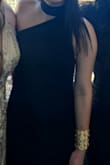 Fits true to size, very comfortable and cute black dress. Was not super long, was able to wear with heels without having to shorten the dress - Ester M.