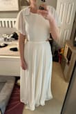 This is flowy and sexy and beautiful. I plan on wearing it for my wedding rehearsal and on my honeymoon. I bought a medium and it was a little loose (I wouldn't have sized down) and it was way too long. Even with heals it was too long for me (I'm 5'7) and I'm having it hemmed - Chelsea S.