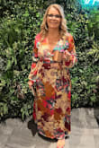 This dress was a dream to wear. Easy wrap style. Definitely used double sided tape to keep the girls covered. Many people wore a cami under but the tape is the way to go! I loved that I didn't have to wear special uncomfortable undergarments. Easy to travel with since the satin material didn't wrinkle in my suitcase.  I received many compliments. I will wear this dress again. - Stefanie B.