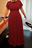 Heavy, beautiful, if you have big hips it does accentuate them. It hits right at the hips and made me feel large but the folks who saw me in it disagreed. - Katlyn K.