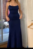 This dress was very pretty, the color and sparkles. The back is cute too. It's not as flattering as others since there is no slit and it's not a kind of material that will suck you in. But still pretty. - Eva M.
