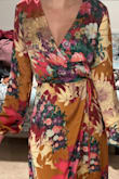 I liked this dress a lot and wore it to an early spring outdoor wedding. I did want to mention that the colors aren't quite as pictured on the model. The predominant color of the dress I received was burnt orange instead of the pinks and creams that I was expecting. Still very pretty though! - Taylor H.
