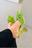 I love the bow! The funky heel and the fact that it is a mule. The shoe is cute and so comfy. Everyone loved my shoes when I had them on!  Def girly statement shoe! - Carola P.