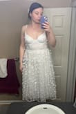 The dress doesn't fit the way it looks in the advertising photo. The corset top is much shorter than expected, and the bottom doesn't lay as flattering as the photo portrayed. - Ariel C.