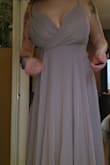 Lovely color. Noticeably heavy with the very thin spaghetti straps. The bust was loose and would require me to get it sized. It's also very long. I'm 5'4" and had a 3" heel and it was still dragging on the ground by about 3 inches - Gail S.