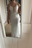 The top is a little large but other than that fits perfectly. Looks exactly like the model. I love it and can't wait to wear it on my wedding day! - Jamie O.