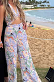 I recommend getting the smaller size if you're in between sizes because the back of the waist band stretches! Wore this to a luau in hawaii and it was perfect. - Jadyn O.