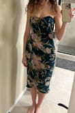 Pretty dress to wear as a guest to a spring wedding. Very comfortable. The only problem, and the reason I'm giving 3 stars, is the boning popped through on both sides under my arms, after 2 hours. I kept having to push it back in. Very annoying and I can't even wear the dress a second time.  I didn't really have trouble with the top falling down. I'm a 32 DD and it fits just right. I wore a stick-on bra and I think that helped it stay up. - Danielle F.