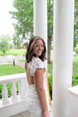 This dress was perfect for my graduation. I have a back tattoo and loved the open back. It was a perfect white and fit my body just lovely. I wore a sticky bra just for a little bit of support. Made very well and loved how they offer a student discount. - Kiley B.