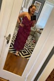 It fits perfectly, the fabric is flows and the color is beautiful! I can't wait to wear it to our nephew's wedding! In the pic I don't have a bra on and of course I won't be wearing my flip-flops and reading glasses. Lol But definitely recommend it! - Lana S.