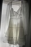 The picture of the white dress is so misleading! I was so excited to wear this for my graduation but it will be getting returned. The fabric is extremely see through and there is no support in the bust area. Cute idea but terrible execution and for the price I am disappointed. - Hayley L.