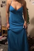 I'm 5'4 and it's too long by about 4 inches, but it fits everywhere else. It's not right around my stomach area and there's no room by the zipper. You can tighten it just around your bust without tightening the stomach or affecting your shoulder straps. It flares a little bit at the very bottom with gives it a Mermaid like shape. - Mali H.