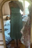 The dress is tight around my chest but not uncomfortable or overly tight. The zipper popped open while bending down after wearing it for 5 minutes. This dress is way too expensive for that quality. So disappointed. - Sadie C.